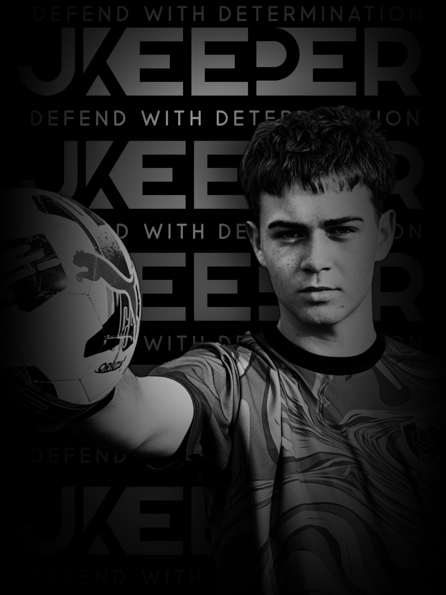 Young goalkeeper holding a ball forward
